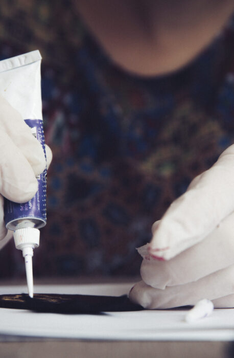 Master working on crafts with glue. High quality photo